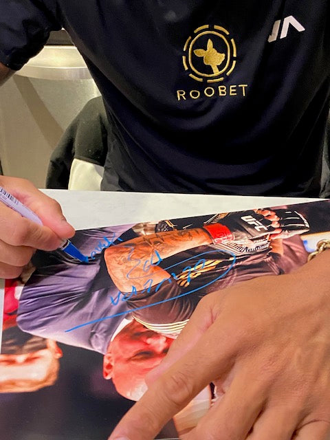 Photo- Charles Oliveira signed 11 by 14 with belt